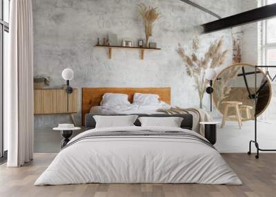 Side view of pacious airy white industrial loft bedroom with bed,  mirror and pampas grass decoration Wall mural