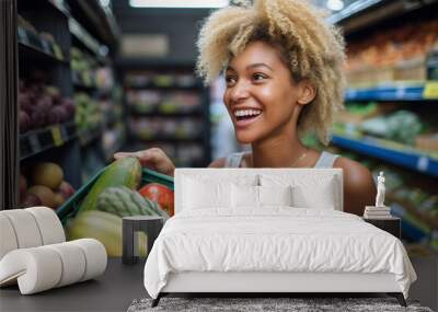 a black woman holding a box of fresh fruits in a grocery store Wall mural