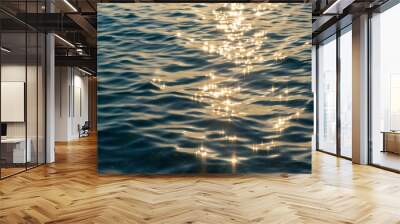 Ripples on the water surface with sun rays glittering  Wall mural