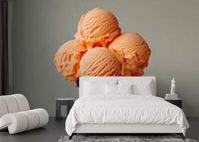 Skeleton hand holding a black cone with orange colored ice cream scoops. Halloween spooky dessert background Wall mural