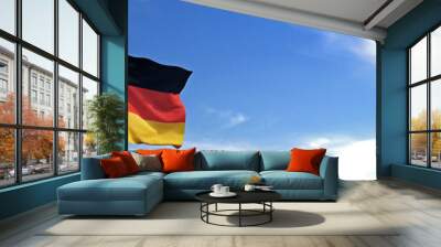 Flag of Germany rise waving to the wind with sky in the background Wall mural