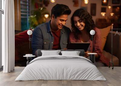 beautiful young indian couple using tablet Wall mural