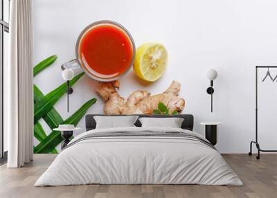 Black tea with lemon and ginger over white background  Wall mural