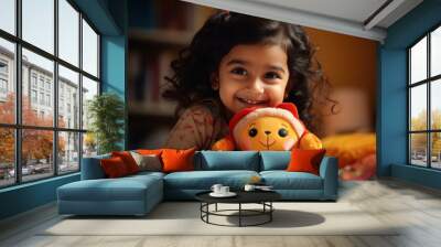 Cute little girl playing with doll at home Wall mural