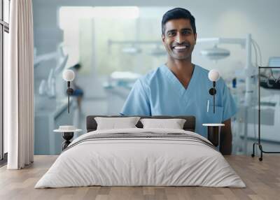 happy young indian male dentist standing in hospital Wall mural