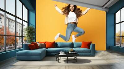 happy young indian woman jumping Wall mural