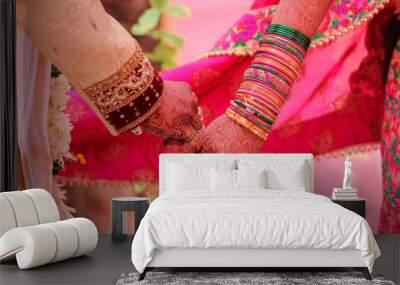 Traditional indian wedding ceremony, groom holding hand in bride hand Wall mural