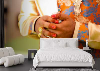 Traditional indian wedding ceremony : groom hand  Wall mural