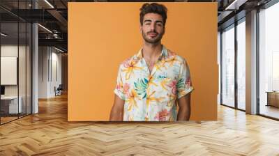 young handsome man wearing summer print shirt Wall mural