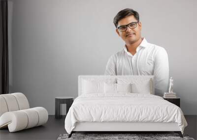 young indian man Standing over white background Wall mural