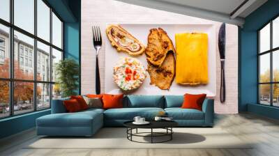 Christmas dish in Venezuela, hallaca, ham bread, salad and pork Wall mural