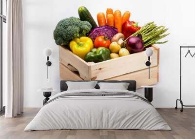 Pine box full of colorful fresh vegetables on a white background Wall mural