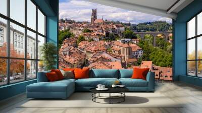 Aerial views of the rooftops, landmarks, river and bridges of the old town of Fribourg in Switzerland. Wall mural