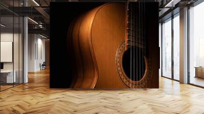 Classical guitar close up on a black background  Wall mural