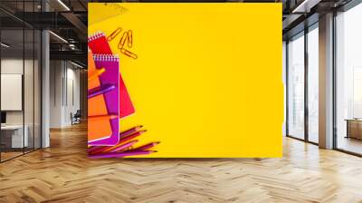 back to school styled scene border with red and orange office supplies on yellow Wall mural