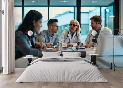 Medical team conversating at a meeting in conference room. Wall mural