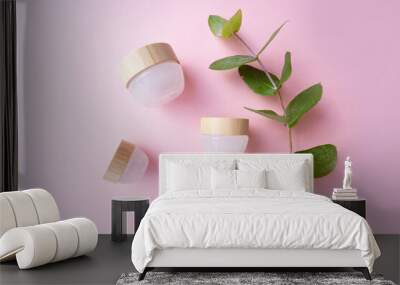 Natural cosmetics concept, cream jars over soft pink background Wall mural