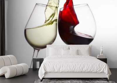 Two wine glasses with splashing of red and white wine isolated on white background, wine tasting concept Wall mural