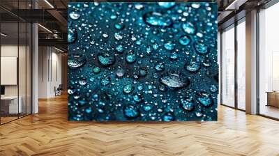 Blue and black colors dominate this close-up of water drops on a leaf Wall mural