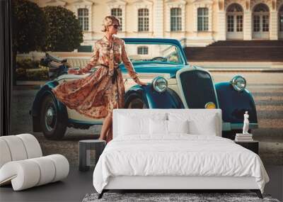 Beautiful lady near classic convertible Wall mural