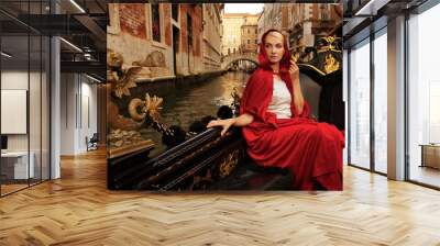 Beautiful woman in red cloak riding on gandola Wall mural