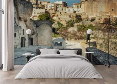 Delivery car in a beautiful Matera town, Italy Wall mural