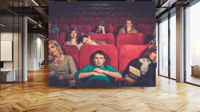 group of people watching boring movie in cinema Wall mural