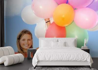 Happy girl with balloons Wall mural