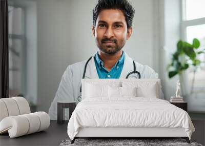 Indian doctor with stethoscope around neck in his office Wall mural