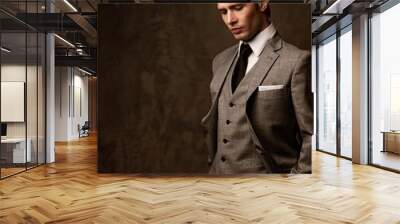 Man in grey suit. Wall mural