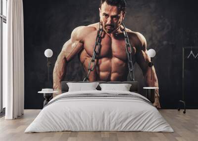 Man showing his muscular body Wall mural