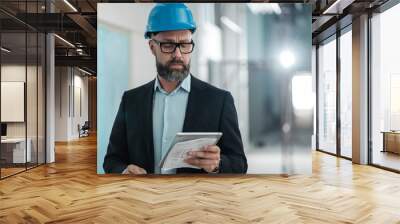 Middle-aged engineer in hardhat Wall mural