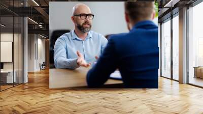 Middle-aged man attending job interview Wall mural