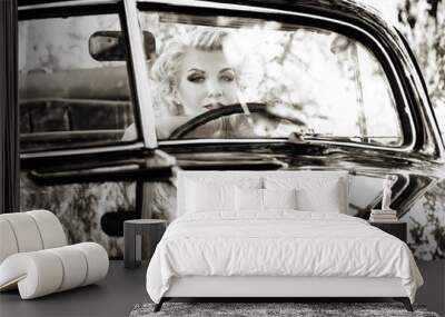 Retro woman behind steering wheel Wall mural