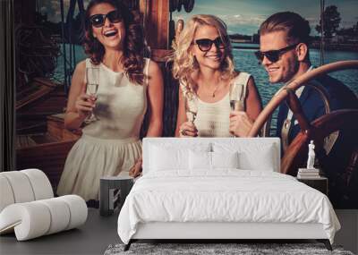 Stylish wealthy friends having fun on a luxury yacht Wall mural