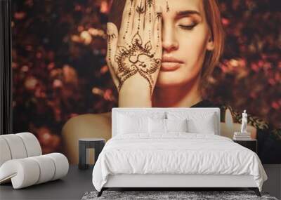 Woman with traditional mehndi henna ornament Wall mural