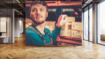 worker on a automotive spare parts warehouse Wall mural