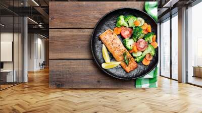 Baked salmon fillet with broccoli and vegetables mix. Wall mural