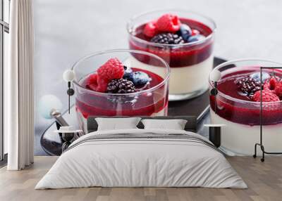 Delicious italian dessert panna cotta with berry sauce, fresh berries and mint on gray background. - Image Wall mural