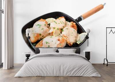 Fresh chicken breast seared in a cast iron skillet with creamy pan sauce. isolated on white background Wall mural