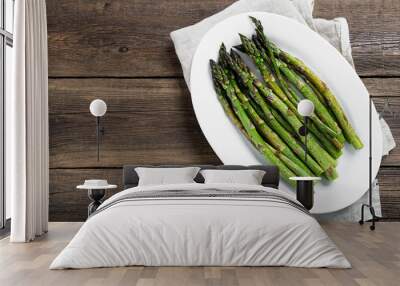 Grilled green asparagus on white plate. top wiew Wall mural