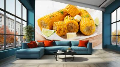 Homemade golden sweet corn cob with butter and salt on white table. top view. Wall mural