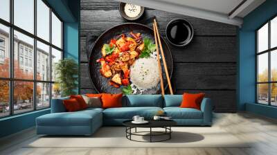 Plate of asian food, rice with chicken meat and vegetables . Wall mural