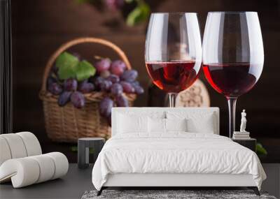 Red wine. Wine. Bottle and glasses of Red wine with ripe grapes. Wall mural