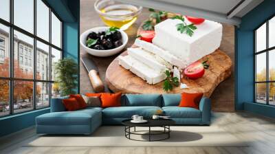 Sliced Feta cheese with herbs and olive oil. Wall mural