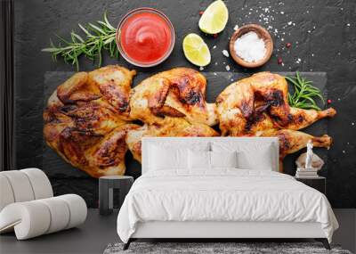 Spatchcocked barbecue chicken for family dinner on black background top view Wall mural