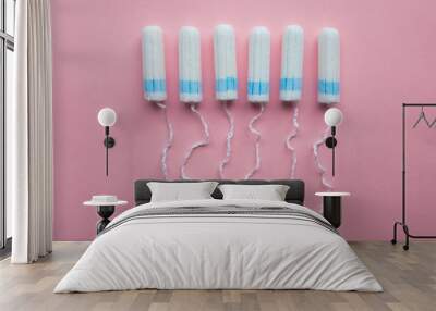 Disposable tampons flat lay on pink background. Wall mural