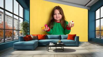 Cute little obese girl of 3-4 years who loves cakes Wall mural