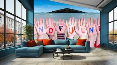 Children Hands Building Colorful English Word Mindfulness. Ocean And Beach As Background Wall mural