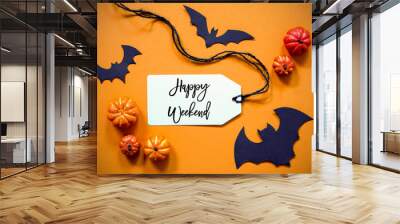 White Label With English Text Happy Weekend. Halloween Decoration Like Bat. Autum Pumpkin Decoration On Orange Background Wall mural